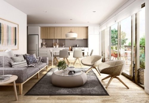 Progettazione interni Cormano: un salone con cucina a vista all'americana.